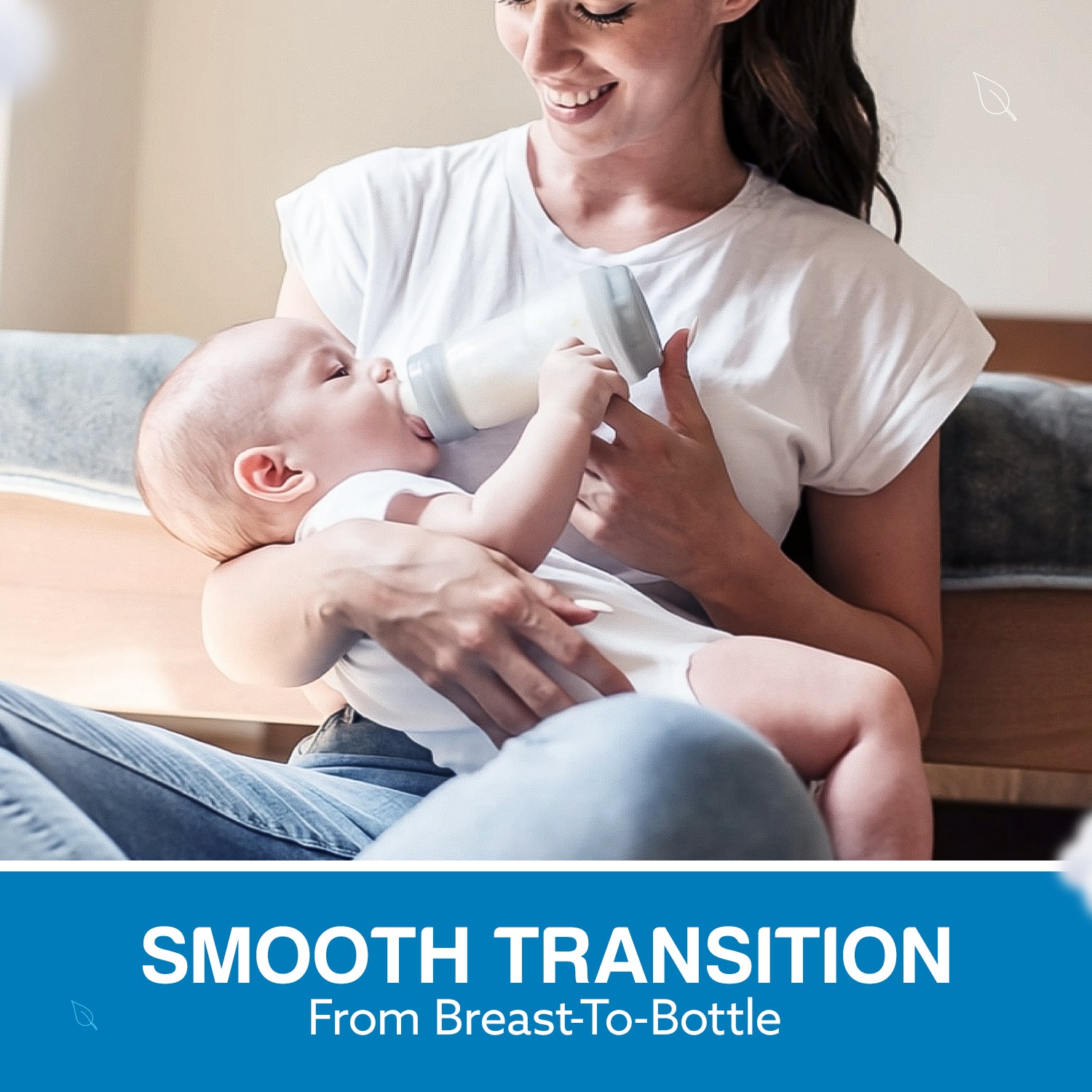 Smiling mom bottle-feeding newborn with SkinSoft Silicone Nipple, breast-to-bottle transition lifestyle shot