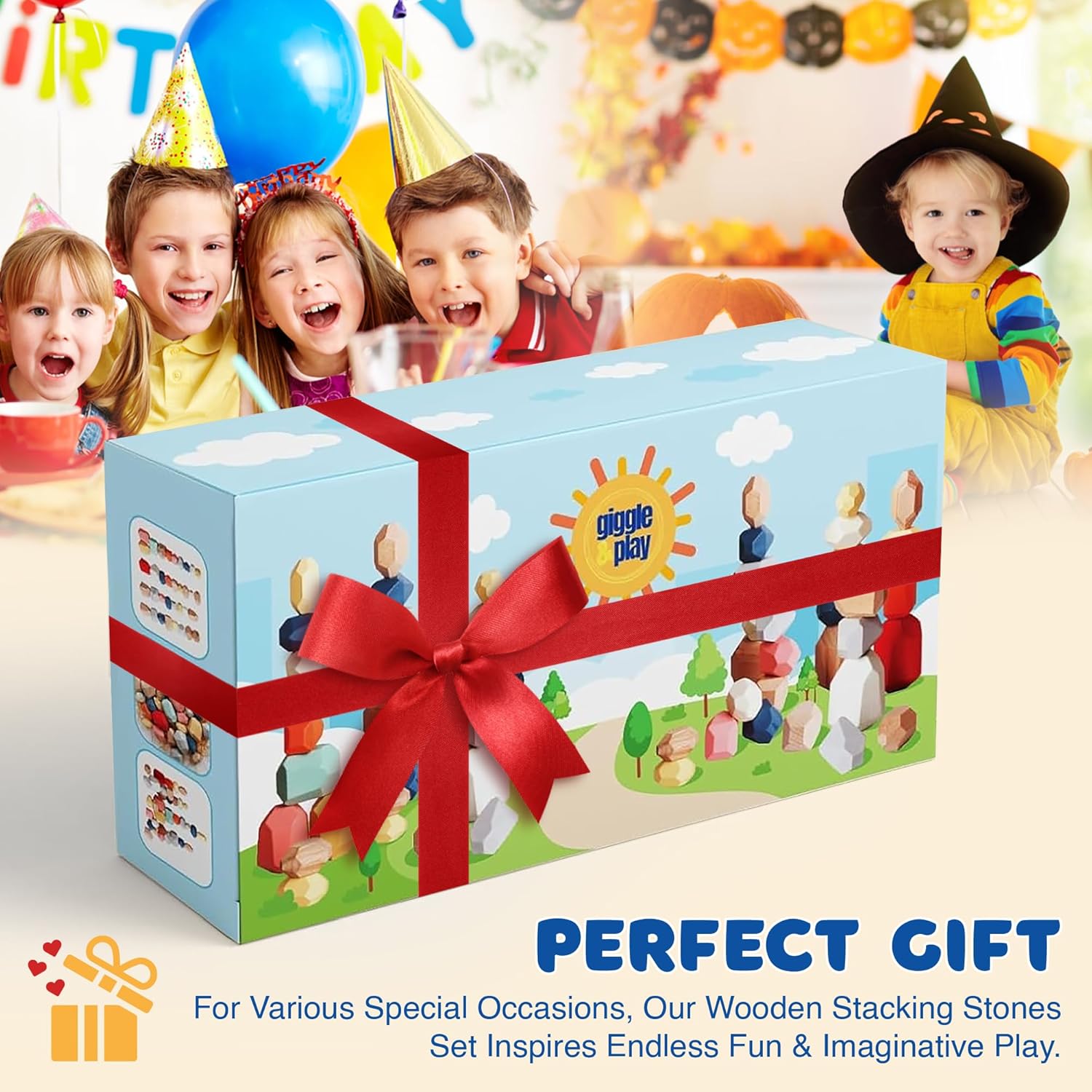 Giggle & Play wooden stacking stones gift box with red bow, kids celebrating at birthday party backdrop