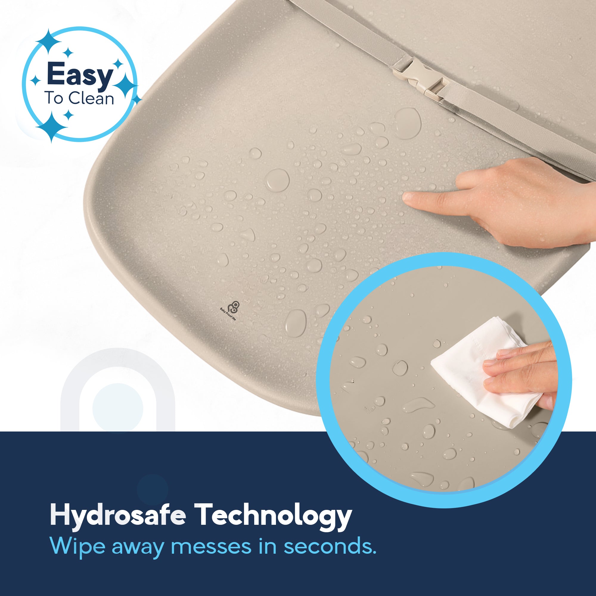 Hand wiping water droplets off beige EVA foam changing pad surface, Hydrosafe Technology callout