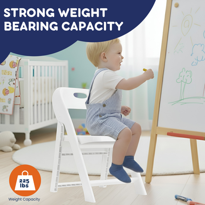 Toddler drawing on easel while seated in white kids folding chair, 225 lbs weight capacity callout visible