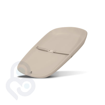 Beige EVA foam changing pad with center safety belt buckle, contoured edges, angled product view