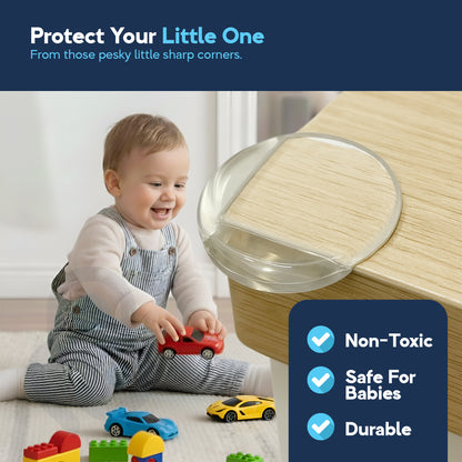 Smiling baby playing near oak table corner secured by clear dome-shaped TPE corner protector
