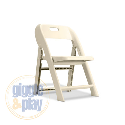 Beige kids folding chair angled view showing fold-flat PP frame, grid-back legs, and carry handle cutout