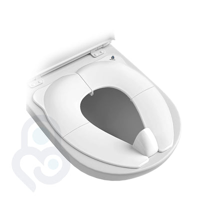 White portable toilet seat trainer open and seated on full-size toilet, non-slip ergonomic fit visible from above